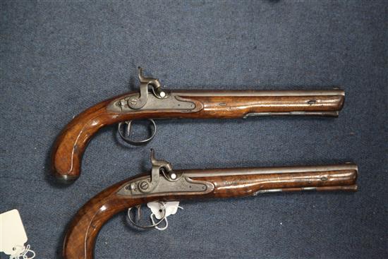 A pair of early 19th century percussion lock pistols, by Wogdon of London, 14in.